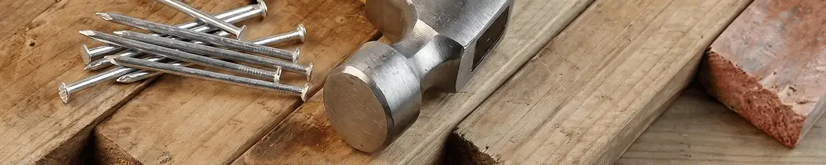 Hammer and nails on hardwood flooring boards in Cambridge, MA
