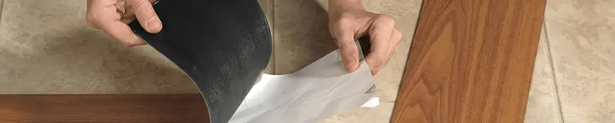 A professional installing vinyl flooring in Cambridge, MA