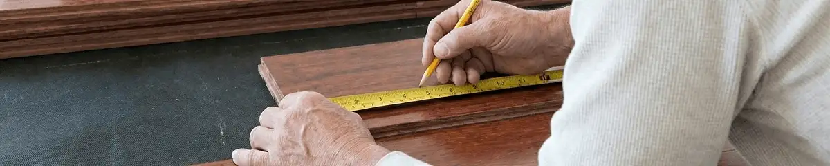 A professional installing wood flooring in Cambridge, MA